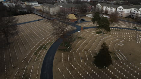 Flyover-aerial-shot-of-Fayetteville-National-cemetery,-many-white-graves,-day