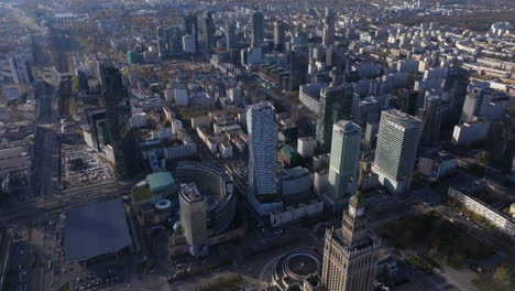 Aerial-reveal-shot-of-the-Palace-of-Culture-and-Science-and-Warsaw-business-district