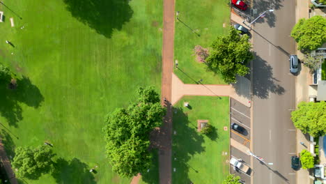 Top-down-aerial-drone-shot-of-a-cyclist-on-a-footpath