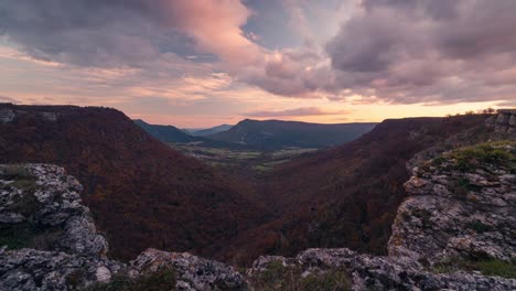 Balcon-de-Pilatos-viewpoint-Ubaba-in-Navarra,-Urbasa-timelapse-during-sunset-in-fall-autumn-season-Large-deep-valley-viewed-from-a-cliff-with-beautiful-clouds