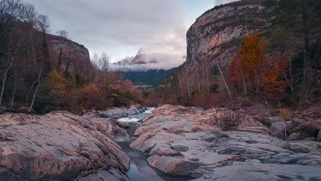 River-in-Ordesa-National-park-Mondarruego-mountain-timelapse-in-fall-autumn-season-in-a-beautiful-cloudy-autumn-sunset