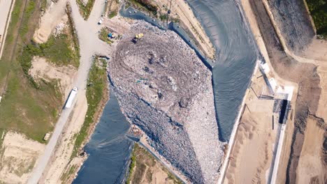 Fixed-shot-over-a-landfill-site,-drone-shot