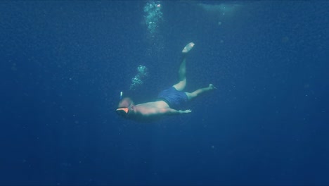 Snorkeler-Free-Diving-Under-Blue-Ocean-Water
