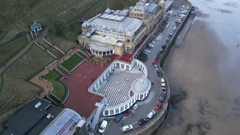 Aerial-top-shot-of-Scarborough-Spa-with-some-visitors-and-their-cars-parked-in-front-of-it-in-Scarborough-,North-Yorkshire,-England