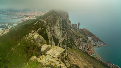 Panoramic-aerial-view-of-the-rock-of-Gibraltar,-roof-tops-and-the-port-of-Gibraltar,-Iberian-peninsula,-UK
