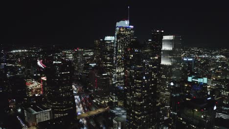 Downtown-Los-Angeles-USA-at-Night,-Cinematic-Aerial-View-of-Skyscrapers-in-Lights-and-Traffic