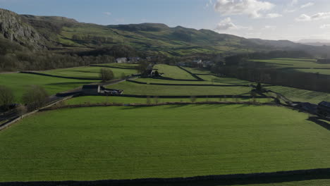 Establishing-Drone-Shot-of-Yorkshire-Dales-Fields-and-Landscape-Stainforth