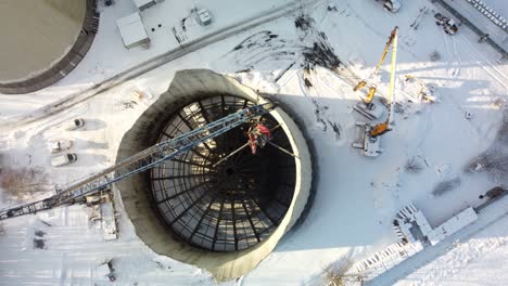 Top-View-Of-Industrial-Cooling-Tower-Being-Demolished-In-Winter