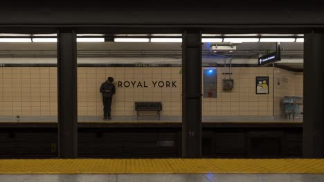 Trains-and-people-at-Royal-York-subway-station-in-Toronto,-timelapse