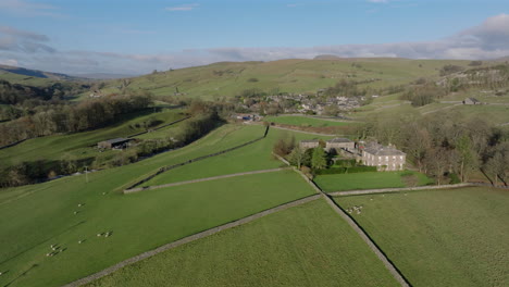 Establishing-Drone-Shot-of-Stainforth-Yorkshire-Dales-Fields-and-Landscape