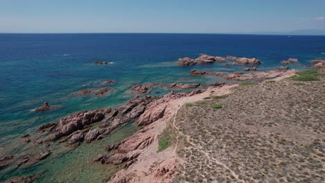 aerial-panoramic-view-of-Mediterranean-sea-with-particular-rocky-coast-and-turquoise-and-emerald-sea,-wilderness-and-protected-area