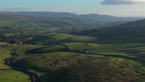 Establishing-Aerial-Shot-Down-Valley-in-Yorkshire-Dales-at-Sunset-UK