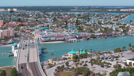 Aerial-view-of-bridge-going-over-to-John's-Pass-Village-in-Madeira-Beach,-FL