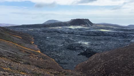 Black-lava-field-from-Fagradalsfjall-volcano-eruption-in-Iceland-2023,-wide-shot