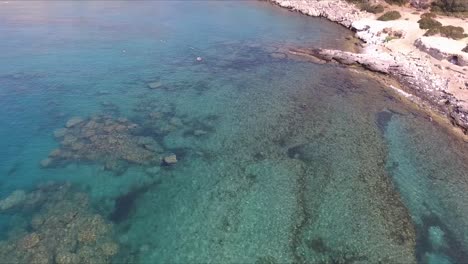 A-shot-of-the-ocean-shallows-and-swimmers-on-the-Greek-island-of-Rhodes