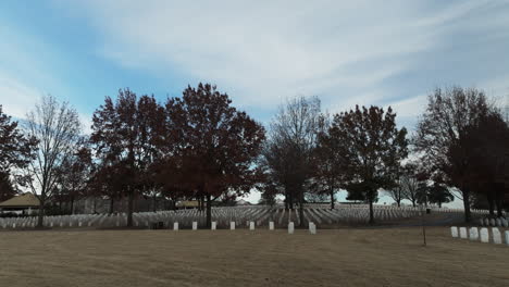 Fayetteville-National-Cemetery-establishing-shot,-many-headstone-graves,-sliding