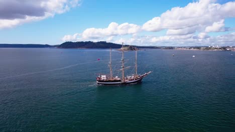 Beautiful-Ship-Sailing-into-Plymouth-with-an-Aerial-Orbital-Drone-Shot