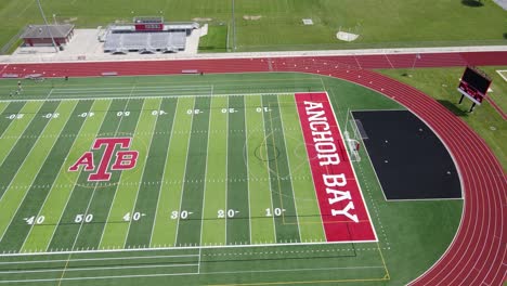 Anchor-Bay-High-School-American-football-field-and-running-track,-aerial-drone-view