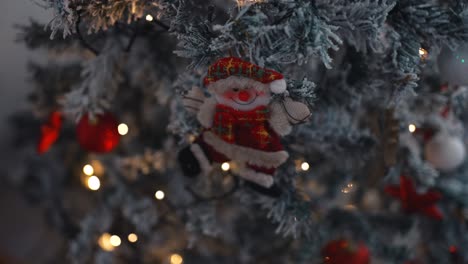 Santa-Claus-Ornament-on-Festive-Tree---close-up