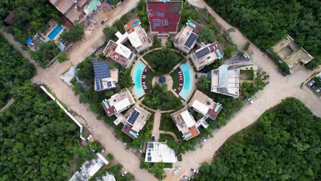 A-spectacular-4K-drone-shot-of-a-unique-and-colorful-resort-located-in-the-outskirts-of-the-city-of-Tulum,-Mexico