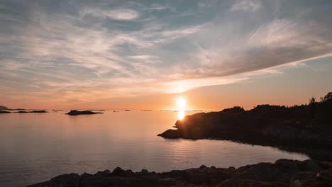 A-timelapse-of-the-midnight-sun-moving-over-horizon-above-the-Norwegian-fjord