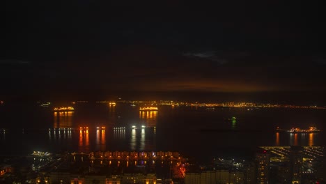 Luces-Nocturnas-Brillando-En-El-Puerto-De-Gibraltar,-Vista-De-Lapso-De-Tiempo