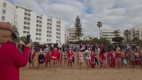 The-gathering-on-the-beach-for-the-annual-traditional-Santa-Swim