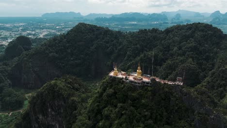 Tiger-cave-temple-atop-a-lush-green-mountain-with-a-panoramic-backdrop