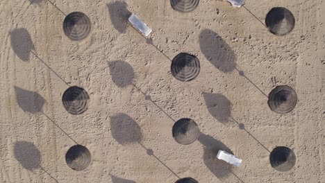Creative-drone-video-with-umbrellas-on-a-beach-casting-beautiful-shadows