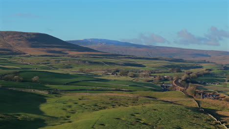 Establishing-Aerial-Shot-of-Hilly-Fields-Yorkshire-Dales-with-Whernside