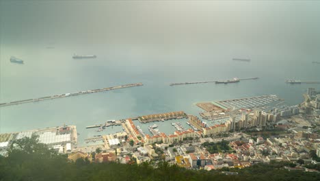 Panoramic-aerial-time-lapse-view-of-Gibraltar-town-and-harbor