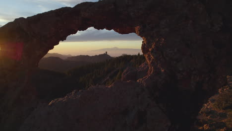 Cinematic-shot-through-the-window-of-Roque-Nublo-during-sunset