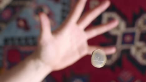 Slowmotion-Flipping-Coin-gets-in-Focus