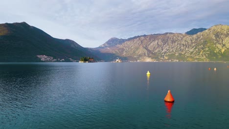 Flying-to-Our-Lady-of-the-Rocks,-Beautiful-Pilgrimage-Site-in-Kotor-Bay,-Adriatic-Sea,-Montenegro,-Aerial-Pano