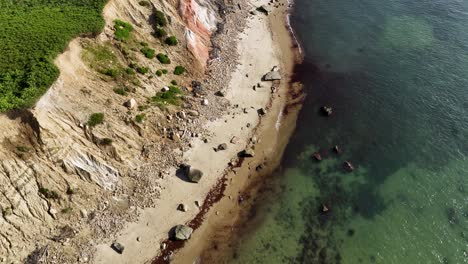 Aerial-view-of-a-steep-cliff-leading-to-the-Massachusetts-ocean-shoreline