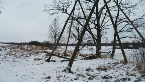 Scary-view-of-swing-move-by-itself-at-outdoor-playground,-winter-landscape