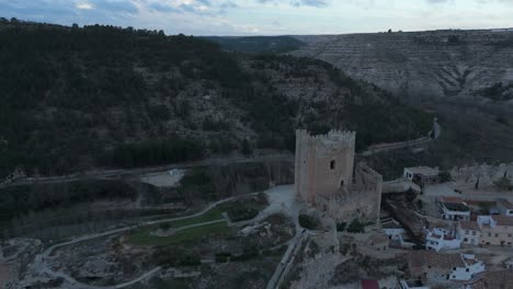 Moving-forward-drone-movement-to-the-castle-of-the-medieval-village-of-Alcalá-del-Jucar,-Spain,-one-of-the-most-beautiful-villages-in-Spain