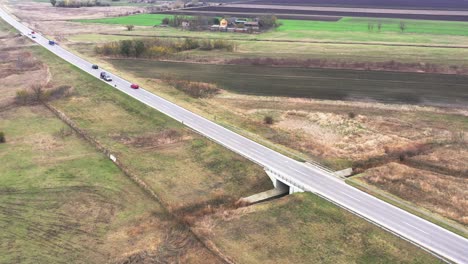 Countryside-road-traffic-from-drone-point-of-view,-aerial-view