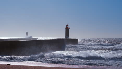 Lighthouse-in-Porto-during-windy-weather-with-big-waves