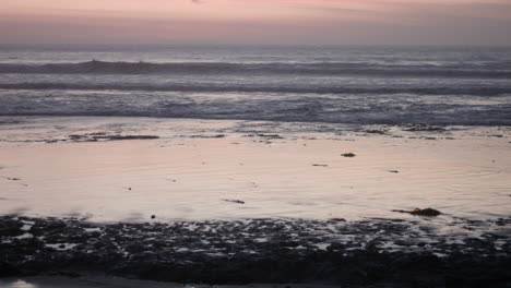 Relaxing-ocean-waves-during-sunset-at-a-beach-near-San-Diego,-California