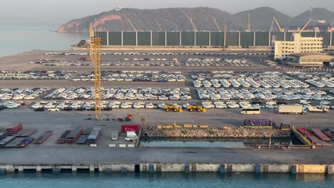 Scene-of-the-cars-parked-neatly-at-the-Laem-Chabang-Port,-the-main-deep-sea-port-of-Thailand-offers-universal-services-to-exchange-goods-worldwide