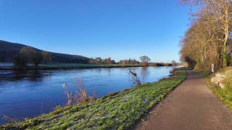 Cycleway-on-the-River-Suir-at-Kilsheelan-Tipperary-Ireland-with-strong-water-flow