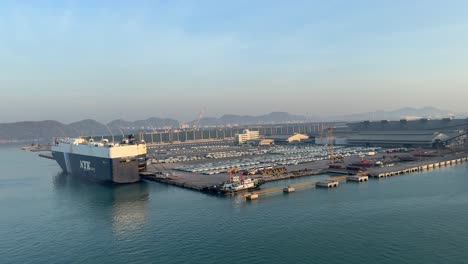 Soft-glow-background-and-cargo-ship-docking-at-a-designated-area-in-the-Port-of-Laem-Chabang,-Pattaya,-Thailand