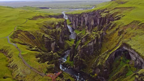 Drone-shot-of-Fjaðrárgljúfur-a-stunning-canyon-in-Iceland-during-summer-time