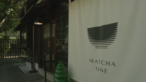 Outside-banner-of-hip-trendy-matcha-shop-with-Asian-style-windows-and-doors