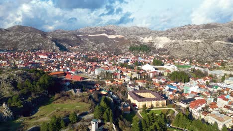 Shifting-Clouds-over-Royal-Capital-of-Cetinje,-Montenegro,-Black-Mountain,-Aerial-Panorama-Hyperlapse
