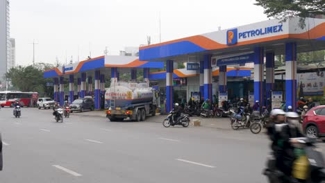 Like-swarm-of-bees-motorcycles-at-petrol-station-as-tanker-delivers-fuel