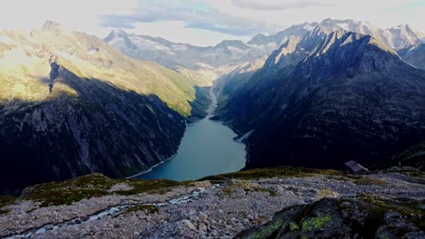 Downward-drone-shot-beautiful-scenic-view-of-Schlegeis-Stausee-or-Schlegeis-reservoir-in-Tirol,-Austrial