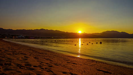 Time-lapse-of-the-sun-rising-over-Dahab,-Egypt's-warm-shoreline