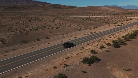 Modern-car-driving-on-desert-highway-in-Nevada